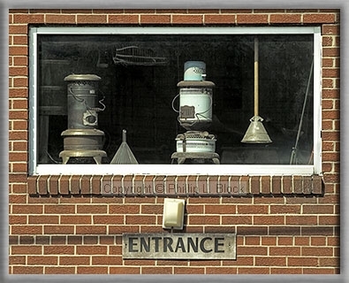 Old Pot-Bellied Stoves in Window