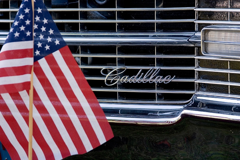 Small Flag in front of '70s-vintage Cadillac