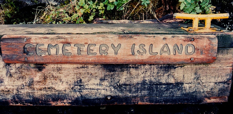 Cemetery Island sign on dock