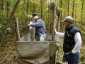 Phil scattering Dad's ashes as Scott looks on